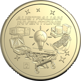 A round metallic gold coin or medallion with the words 'AUSTRALIAN INVENTIONS' at the top and several illustrated invention icons around a central light bulb, shown on a plain white background.