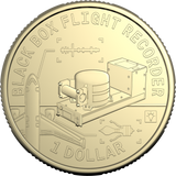 A gold-colored commemorative coin featuring a black box flight recorder illustration and the text 'BLACK BOX FLIGHT RECORDER' and '1 DOLLAR'.